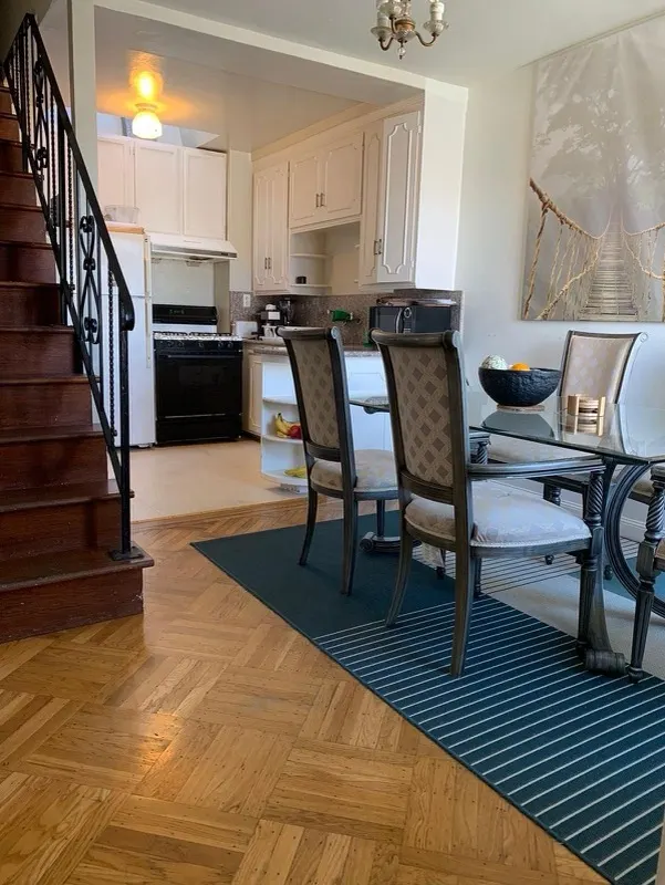 Dining area and staircase with floors cleaned by Quick Cleaning Services