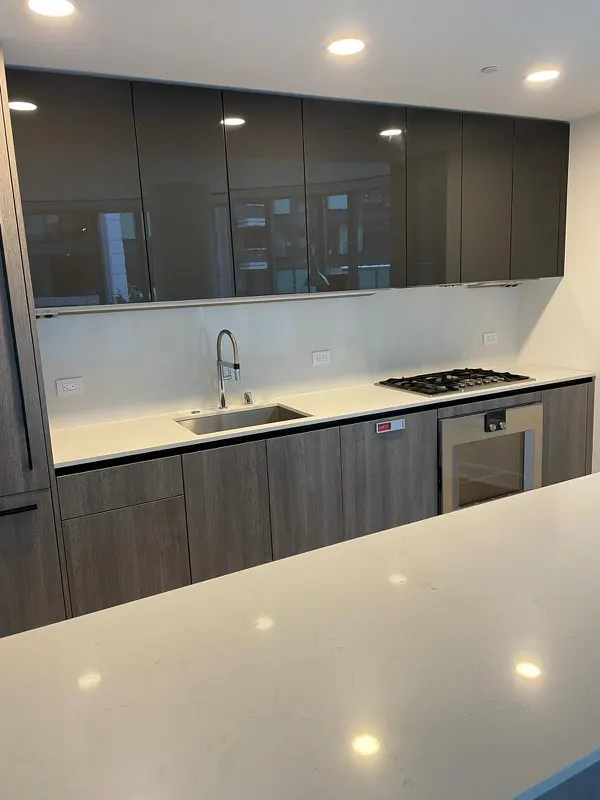 Contemporary kitchen with quartz countertops after professional cleaning