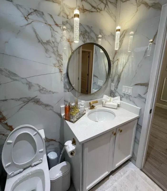 Marble powder room photographed after a house cleaning