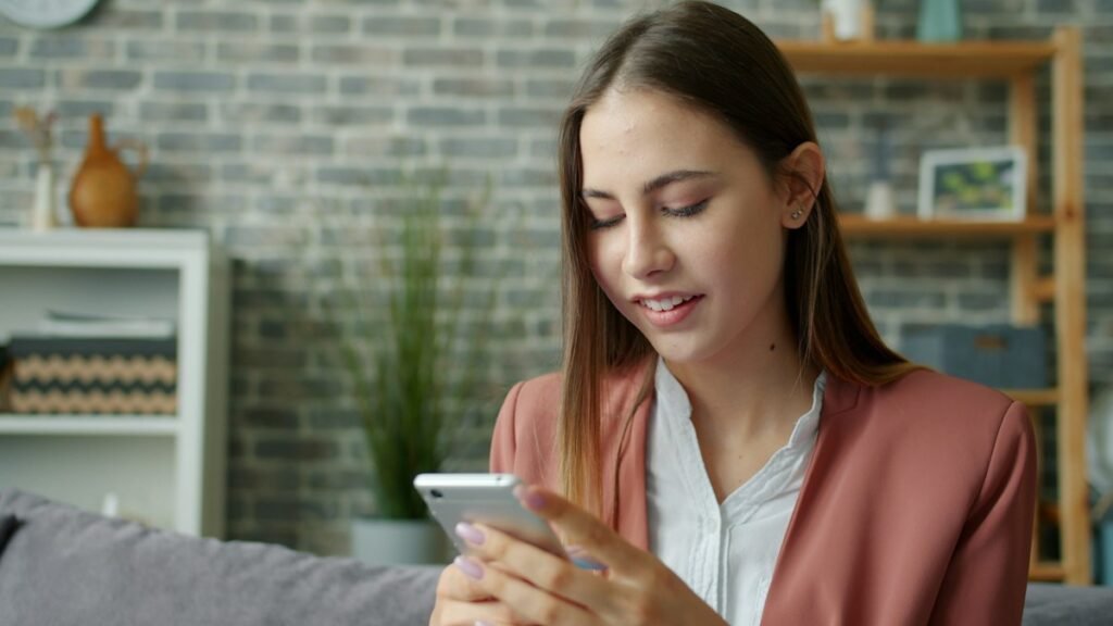 Person at home sending a cleaning request from a smartphone